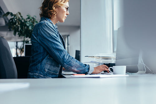 Young businesswoman working in office