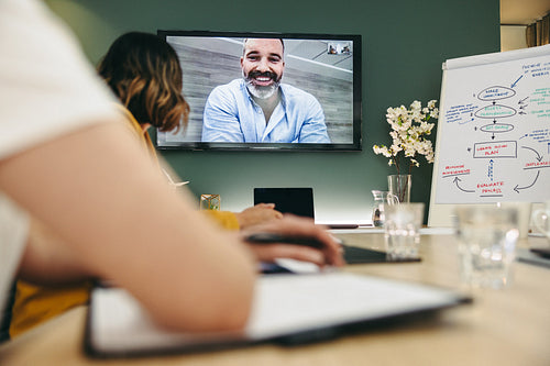Creative businesspeople having a video conference in a boardroom