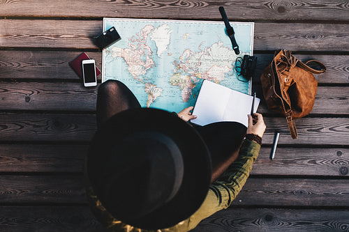 Tourist exploring the world map.