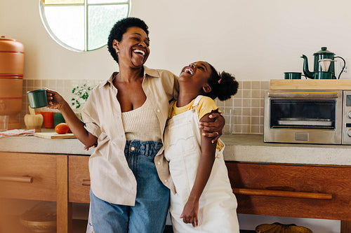 Mother and daughter sharing a warm moment in the kitchen