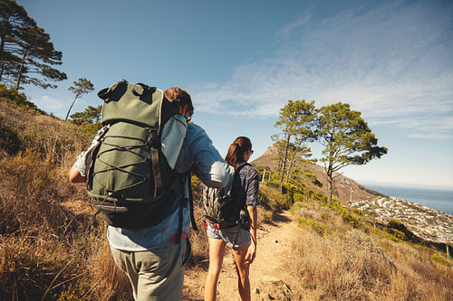 Young couple hiking in mountain