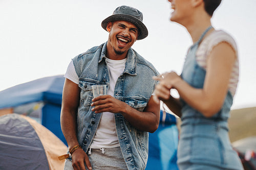 Fun festive vibes: Friends laughing and living their best lives at festival camp