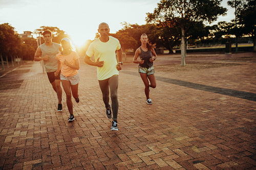 Athletes running at the city park