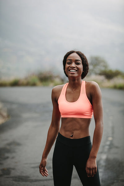 Young woman athlete on road
