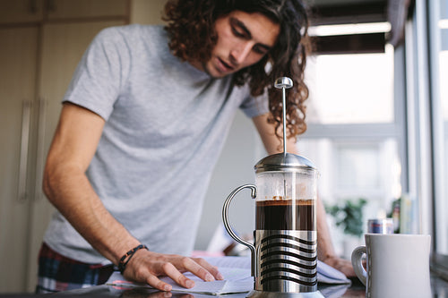 Student studying in kitchen