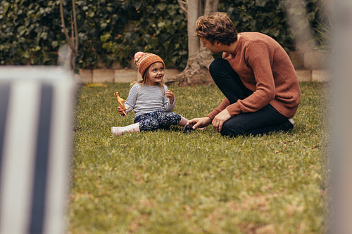 Father and daughter playing in park