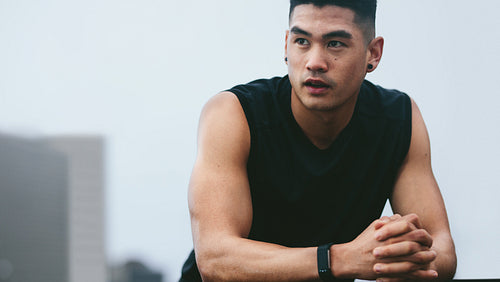 Fitness male model resting after his workout