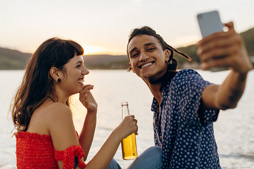 Cute young couple taking a selfie on a vacation