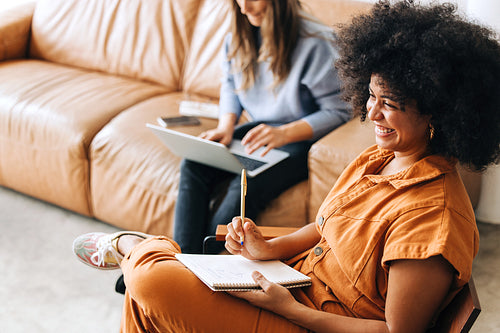 Ethnic businesswoman smiling happily in an office lobby