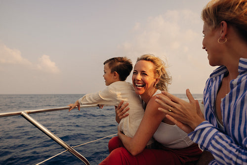 Joyful family embarking on an oceanic boat adventure