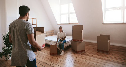 Young couple moving into new home
