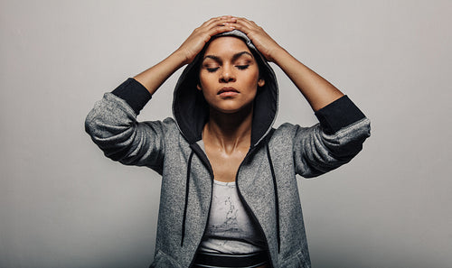 Sportswoman wearing a hoodie jacket