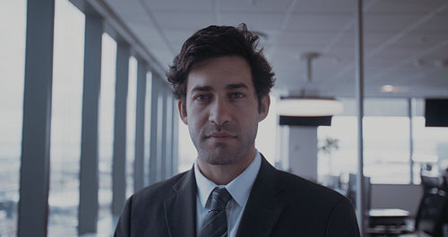 Confident young businessman in office