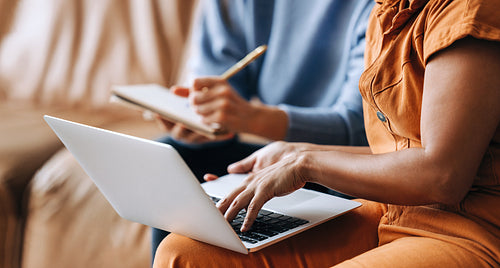 Businesswomen using a laptop in an office