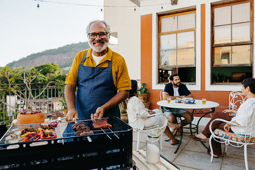 Family enjoying a Brazilian barbecue on a sunny day