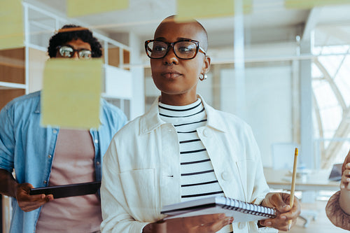 Creative business people brainstorming ideas in a professional office