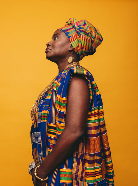 Elegant African woman wearing cultural clothing in a studio