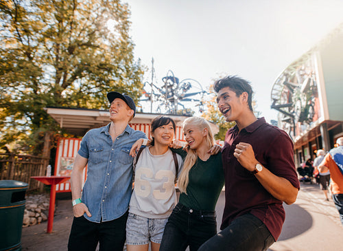 Friends enjoying a walk together in amusement park