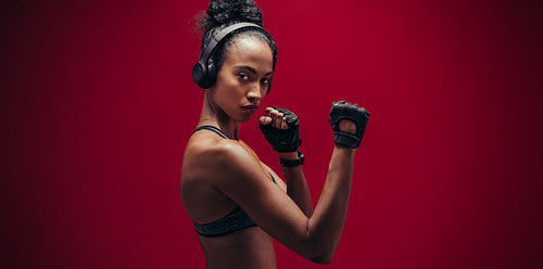 Strong woman standing in fighting stance
