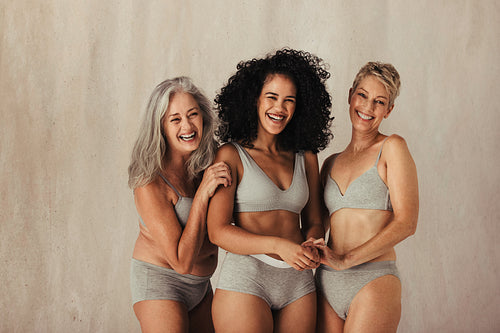 Women embracing their matural bodies together