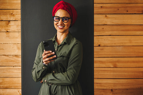 Businesswoman using a smartphone in a modern office
