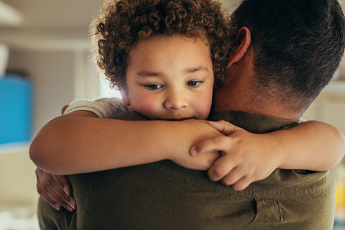 Close up of a kid hugging his father