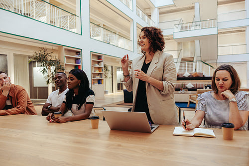 Advertising agency team engaged in an active meeting in a modern office space