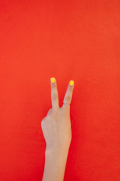 Hand with two fingers up in the peace 