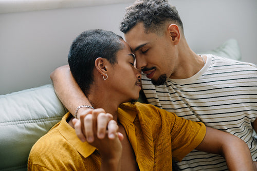 Loving couple in an intimate and affectionate moment on the sofa