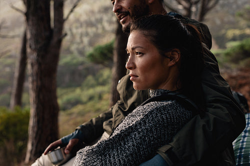 Young couple resting after hike