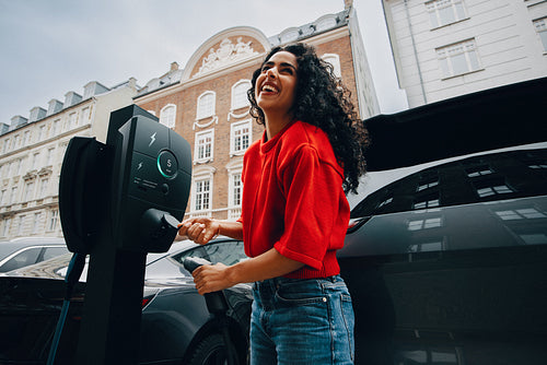Her charging stop with an electric car fits the pace of city commuting