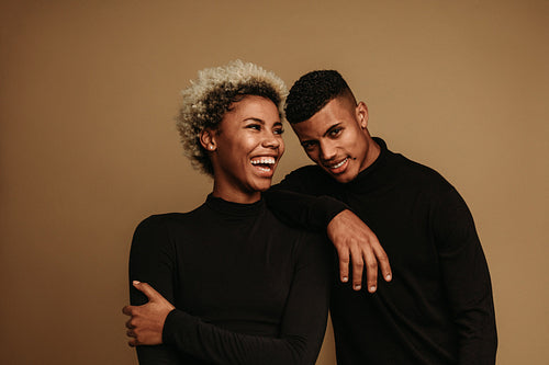 Cheerful african american couple standing together