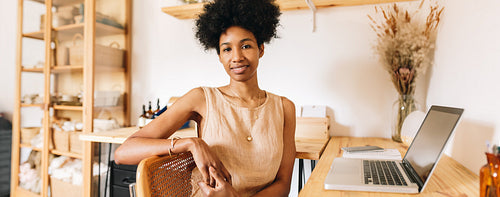 Businesswoman sitting in jewelry studio