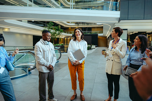 Group of diverse colleagues enjoying a casual office meeting