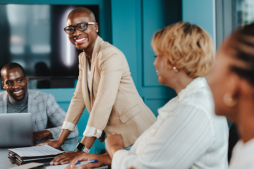 Business woman leading a successful business team in a boardroom meeting