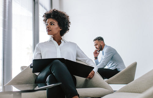 Business woman in office lobby