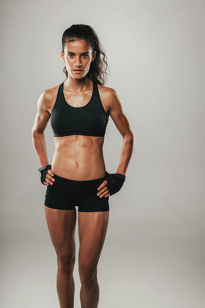 Strong fit young woman in black sportswear