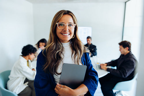 Confident businesswoman gathers her team for a discussion