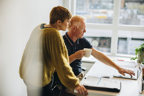 Business professionals working together on a laptop