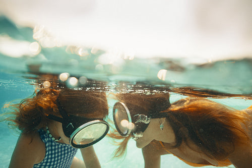 Underwater family exploration during holiday with snorkeling gear