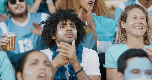 Argentinian soccer fans cheering a goal