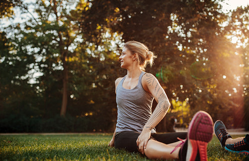 Fit young woman doing stretching workout