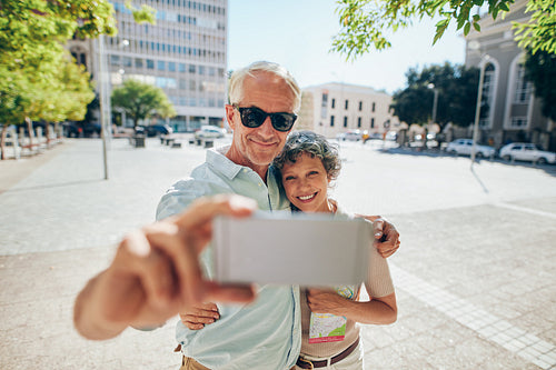 Loving senior couple taking a selfie