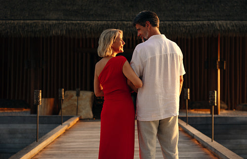 Couple enjoys romantic moment on a tropical vacation at sunset