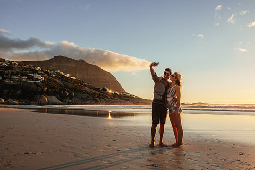 Romantic young couple taking selfie