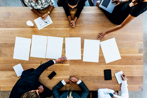 Business man and woman meeting with blank signs on table