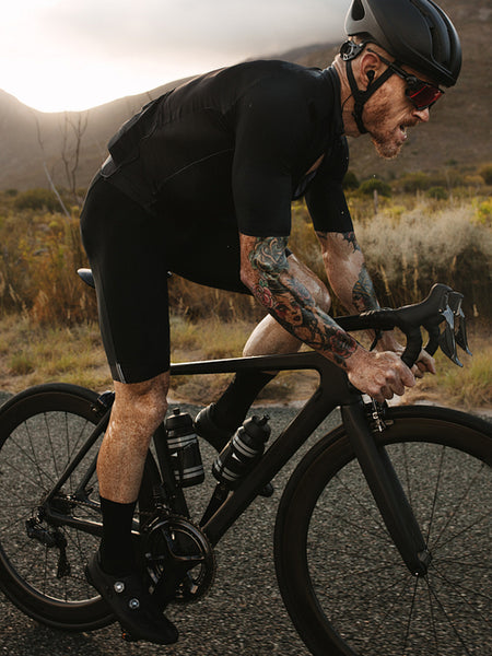 Cyclist sprinting on highway road