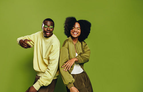 Portrait of friends as a youthful duo dancing together with playful energy