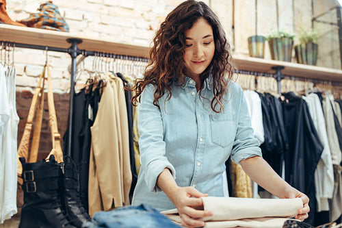Woman shopping in clothing store