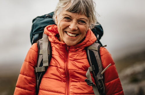 Portrait of a smiling woman on a hiking trip